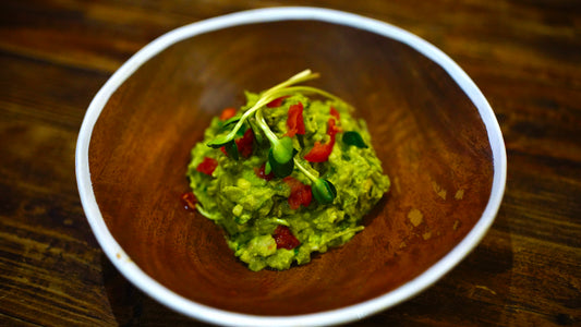 Sunflower Microgreen Guacamole with cherry tomatoes, lemon juice, garlic and salt